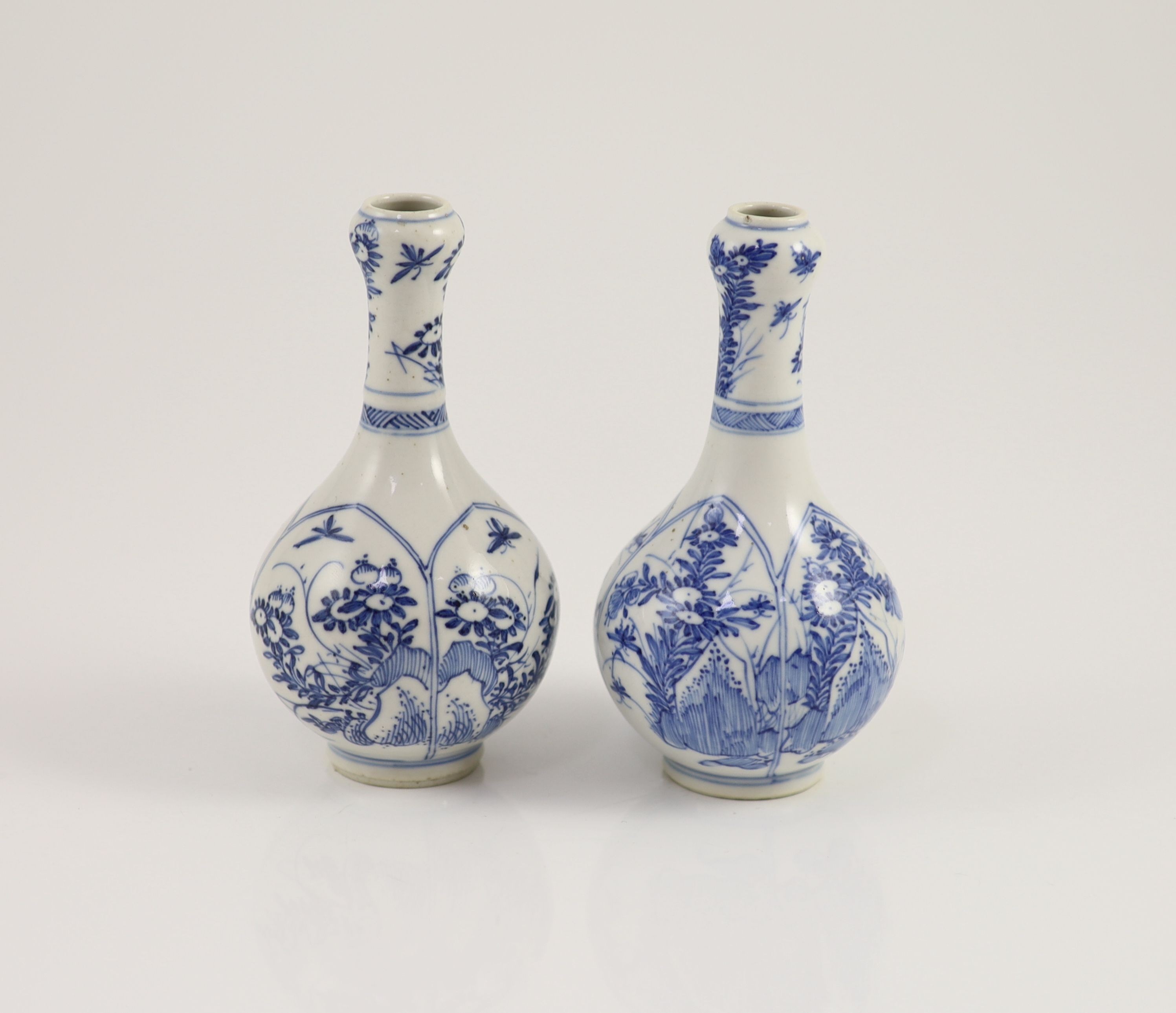 A pair of small Chinese blue and white garlic-neck vases, Kangxi period 13.5 cm high